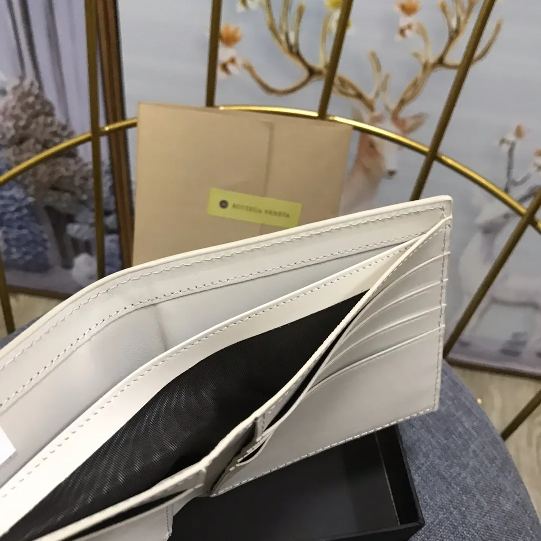 Padded leather wallet • 8 card slots, 1 bill compartment and 2 additional compartments • Check pattern nappa padding exterior • Smooth calfskin lining 993#